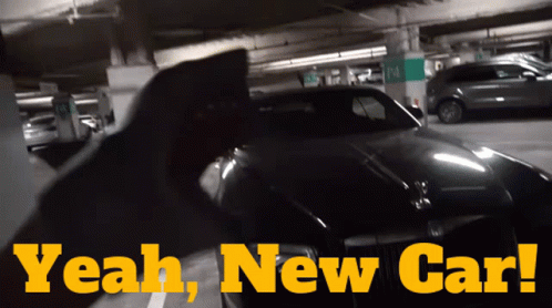 A Car Is Parked In A Parking Garage With The Words " Yeah New Car " Above It GIF