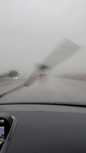 A Car Windshield Wiper Is Being Used To Clean The Windshield Of A Car GIF