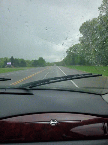 a car windshield with a sign that says ' i 'm sorry i 'm late ' on it