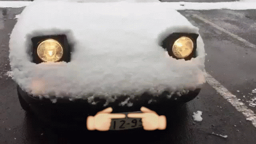 A Car With A License Plate That Says T2-9 Is Covered In Snow GIF