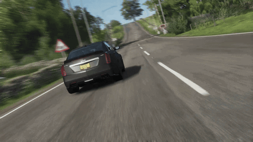 A Car With A New York License Plate Is Driving Down The Road GIF