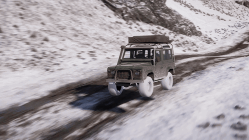 A Car With A Tent On Top Of It Is Driving On A Snowy Road GIF