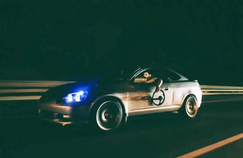 A Car With A Wheelchair On The Driver 'S Door GIF