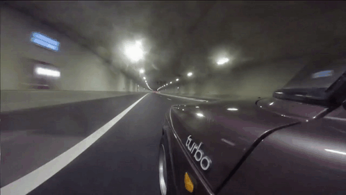 A Car With Turbo Written On The Side Of It GIF
