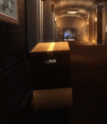 A Cardboard Box In A Dark Hallway With A Sign That Says End GIF