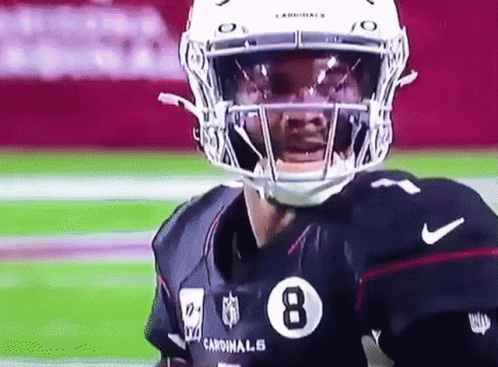 A Cardinals Football Player Wearing A Helmet And A Jersey With The Number 8 On It GIF