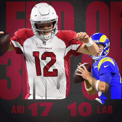 A Cardinals Player Is Holding A Football In Front Of Another Player GIF