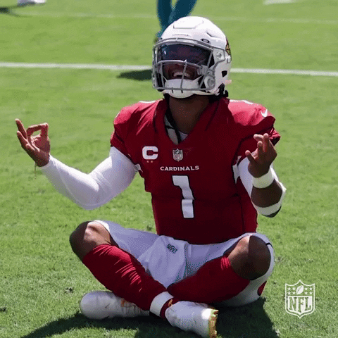 A Cardinals Player Is Sitting On The Field With His Legs Crossed GIF