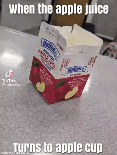 A Carton Of Apple Juice Is Sitting On A Table With A Caption That Says When The Apple Juice Turns To Apple Cup GIF