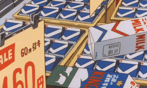A Carton Of King Milk Sits On A Shelf Next To Other Cartons GIF