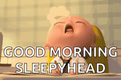 A Cartoon Baby Is Yawning And Says `` Good Morning Sleepyhead '' . GIF