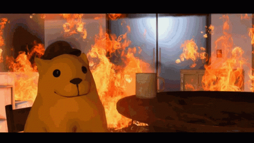 A Cartoon Bear Is Standing In Front Of A Fire GIF