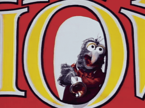 A Cartoon Bird Is Playing A Trumpet In Front Of A Red And Yellow Sign That Says 101 GIF