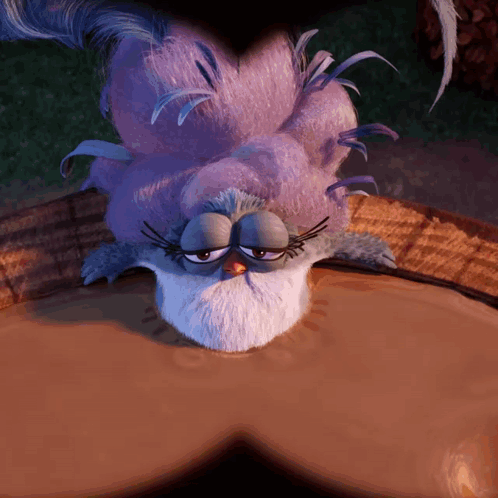 Purple Feathers Bird Lying In Mud GIF
