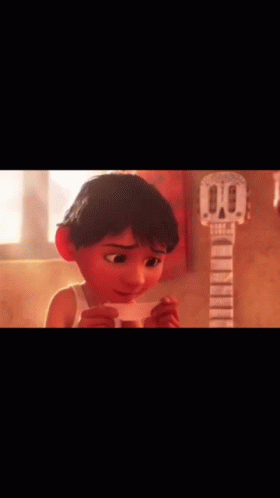 A Cartoon Boy Is Holding A Piece Of Paper In Front Of A Guitar . GIF