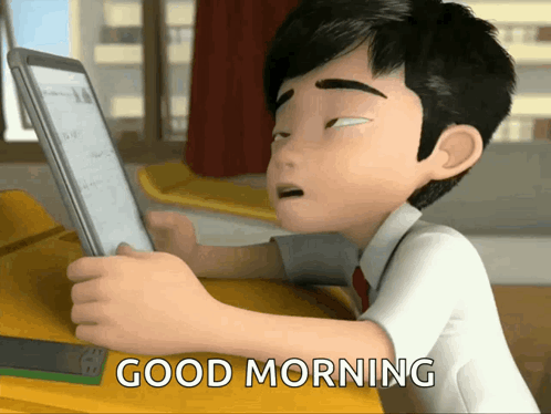 A Cartoon Boy Is Sitting At A Desk Using A Tablet And The Words Good Morning Are Above Him GIF