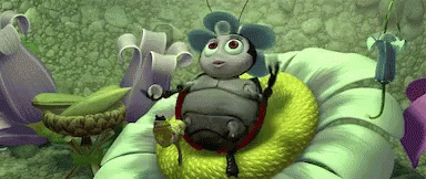 A Cartoon Bug Is Sitting On Top Of A Green Flower . GIF