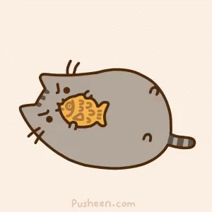A Cartoon Cat Is Eating A Fish Shaped Cookie GIF