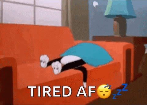 A Cartoon Cat Is Laying On A Couch With The Words Tired Af Written Above It . GIF