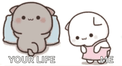 A Cartoon Cat Is Laying On A Pillow And A Cartoon Cat Is Standing Next To It . GIF