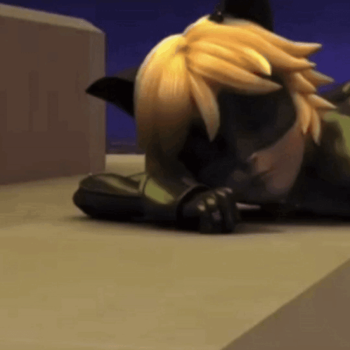 A Cartoon Cat Is Laying On The Ground With His Head On His Paws . GIF