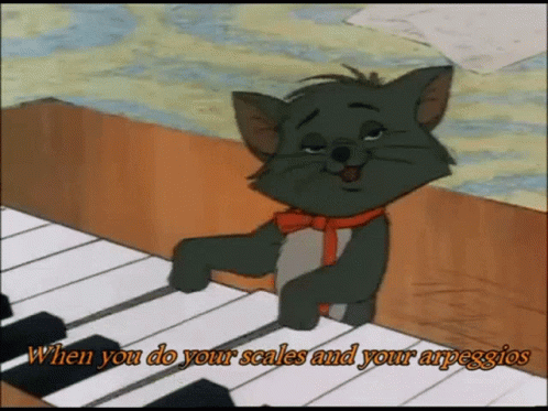 A Cartoon Cat Is Playing A Piano With The Words When You Do Your Scales And Your Arpeggios GIF