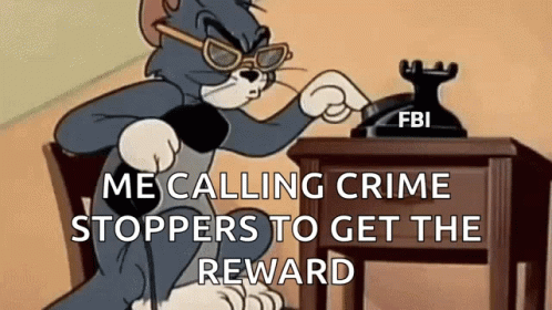 A Cartoon Cat Is Sitting At A Desk Talking On A Telephone . GIF