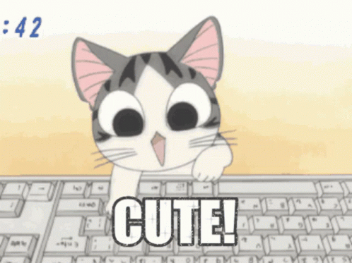 A Cartoon Cat Is Sitting At A Keyboard With The Word Cute Written On It GIF