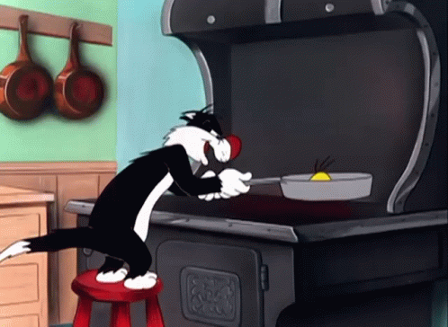 A Cartoon Cat Is Sitting On A Red Stool Cooking GIF