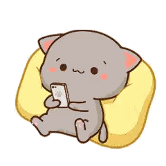 a cartoon cat is sitting on a yellow pillow looking at a cell phone .