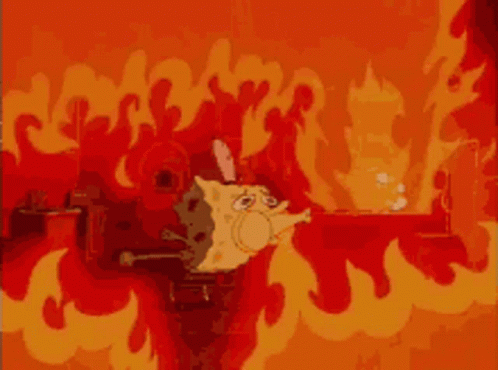 A Cartoon Cat Is Surrounded By Flames In A Fire Scene GIF