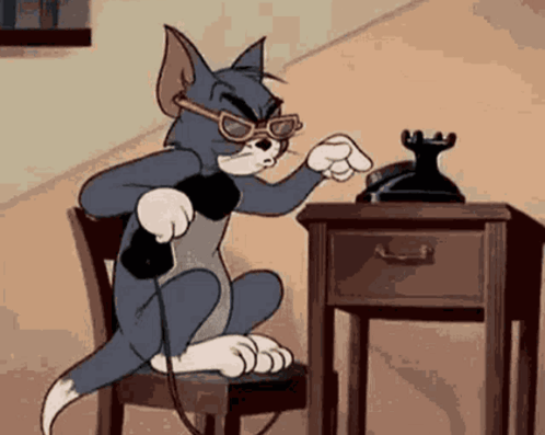 A Cartoon Cat Is Talking On A Telephone While Wearing Sunglasses GIF