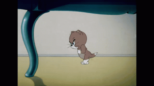 A Cartoon Cat Is Walking Under A Blue Table GIF