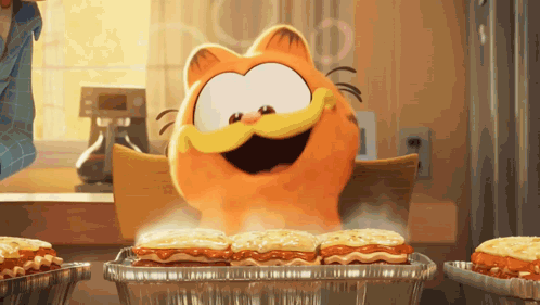 A Cartoon Cat Named Garfield Is Sitting At A Table Eating Lasagna GIF