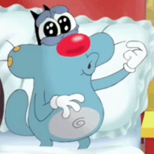 A Cartoon Cat With A Red Nose Is Standing Next To A Bed . GIF