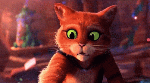 A Cartoon Cat With Green Eyes Looking At The Camera GIF
