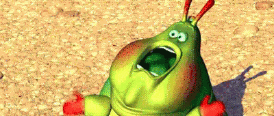 A Cartoon Caterpillar With Its Mouth Open Is Laying On The Ground . GIF