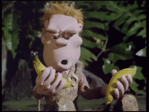 A Cartoon Character Eating A Banana With A Surprised Expression On His Face GIF
