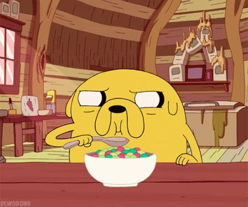 a cartoon character from adventure time is eating a bowl of cereal with a spoon