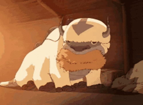 A Cartoon Character From Avatar The Last Airbender Is Sitting In The Dirt . GIF