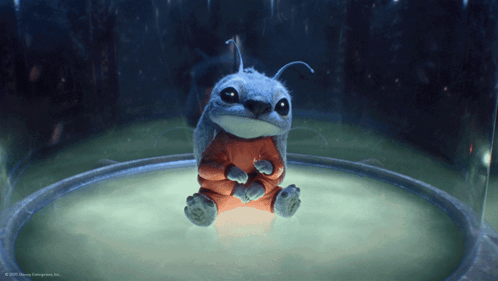 A Cartoon Character From Disney Enterprises Inc. Is Sitting In A Glass Container GIF
