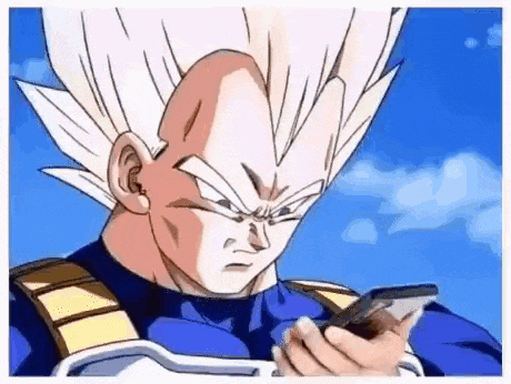 A Cartoon Character From Dragon Ball Z Is Holding A Cell Phone In His Hand . GIF