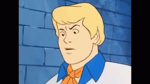 A Cartoon Character From Scooby Doo Is Making A Funny Face . GIF