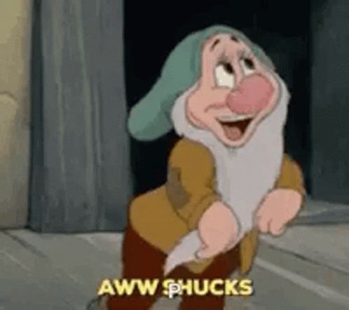 A Cartoon Character From Snow White And The Seven Dwarfs Is Standing In Front Of A Wall And Laughing . GIF