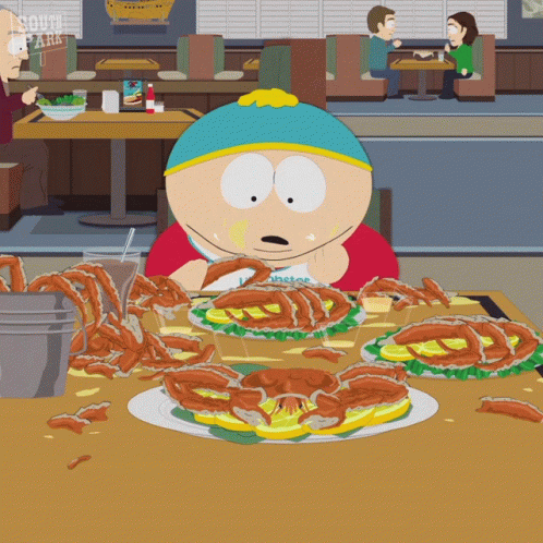 A Cartoon Character From South Park Is Sitting At A Table Eating A Crab Sandwich GIF