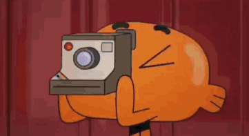 A Cartoon Character From The Amazing World Of Gumball Is Holding A Polaroid Camera . GIF