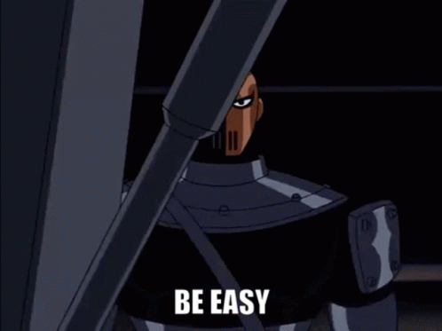 A Cartoon Character From The Batman Animated Series Is Standing In A Dark Room . GIF