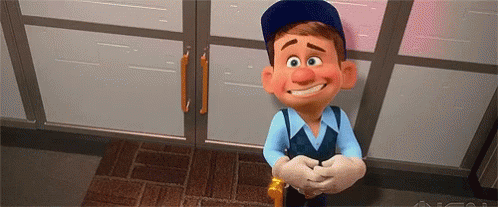 A Cartoon Character From The Movie Wreck It Ralph Is Smiling And Standing In Front Of A Door . GIF