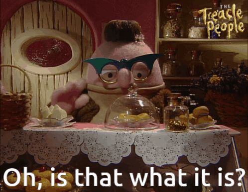 A Cartoon Character From The Treacle People Is Standing At A Table GIF