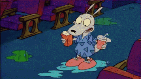 A Cartoon Character Holding A Drink And A Popcorn Box GIF